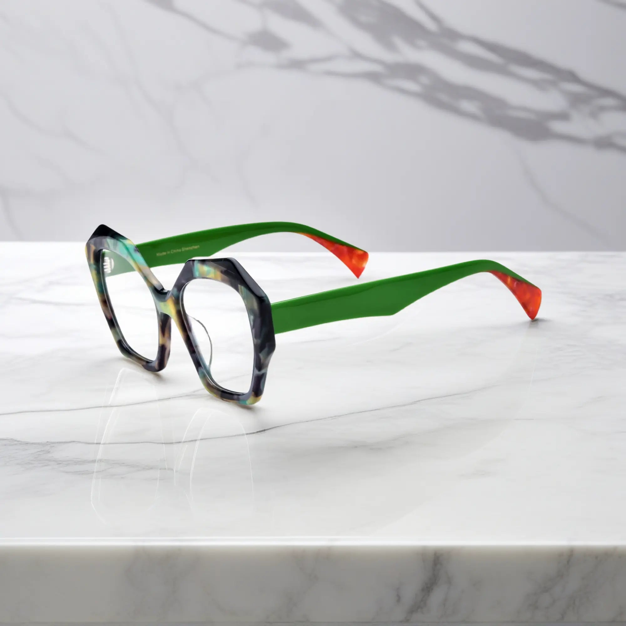 Side profile showcasing the sculpted green temples and bold acetate design of Forest Marble eyeglasses.